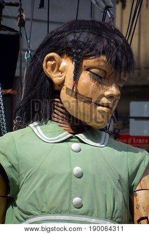 MONTREAL QUEBEC CANADA 19 05 17: The little giant girl sleeping in Place d'arme in old Montreal for the 375e anniversary of the city, by Royal De Luxe company Nantes France