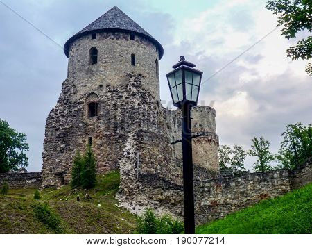 Watchtower and surrounding wall of castle ruins in Cesis town, Latvia