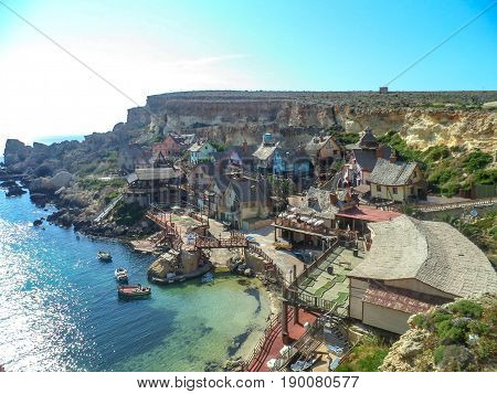 Traditional colorful houses in the famous Popeye Village at Anchor Bay, Il-Mellieha, Malta
