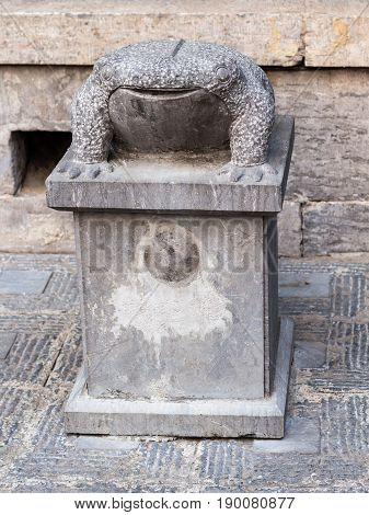 Stone Toad Statue Near Temple