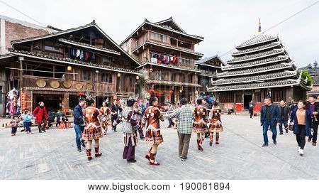 Tourists And Round Dance On Square In Chengyang