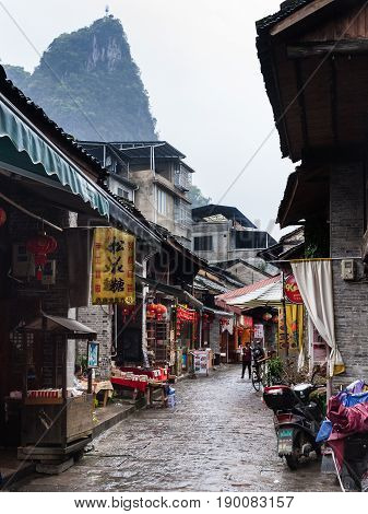 People On Market Street In Xingping Town