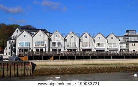Wadebridge, Cornwall, Uk - April 6Th 2017: Row Of Modern Riverside Apartments Next To The River Came
