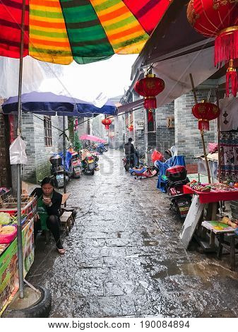 Sellers And Stalls On Street Market In Xingping