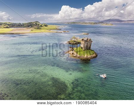 Aerial of the historic castle Stalker in Argyll, Scotland