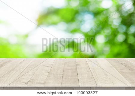 Empty wooden table for product placement or montage with focus to table top in the foreground, with white background. Wooden board empty table perspective.