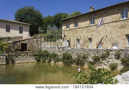 BAGNO VIGNONI, ITALY - JUNE 3 2017: the small medieval town of Bagno Vignoni in Italy with its hot spring thermal bath