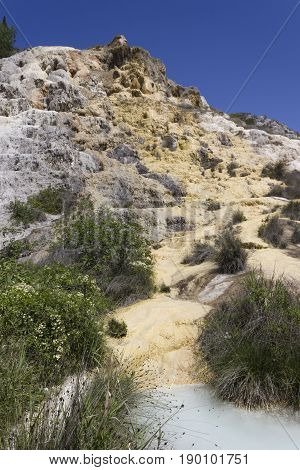 BAGNO VIGNONI, ITALY - JUNE 3 2017: The scenic hot spring pool of Bagno Vignone in Tuscany free accesible area through the nature