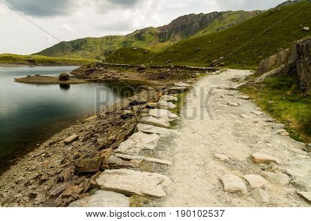 Miners Track Crossing Bridge At Llyn Llydaw On Snowdon.