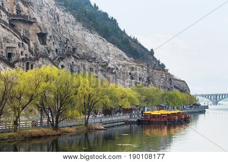 View Of Carved West Hill With Longmen Grottoes