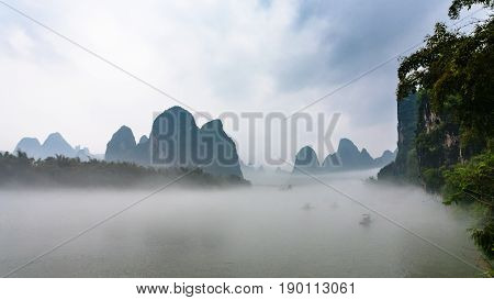 Panoramic View Of Fog Over River Near Xingping