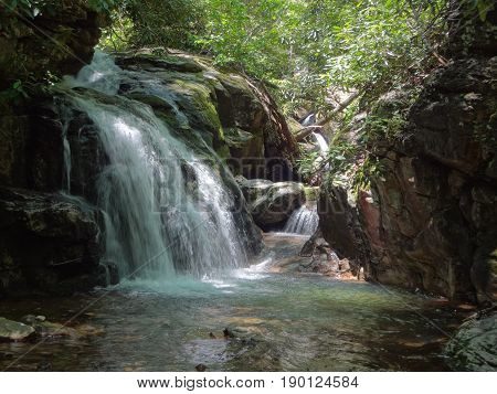 A lovely waterfall cascading into a deep pool at the Blue Hole in East Tennessee, USA.