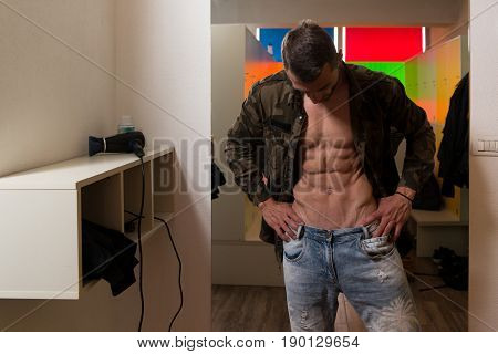Fit Man In Locker Room Changes Clothings