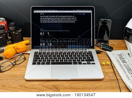 PARIS FRANCE - JUNE 6 2017: Apple Computers website on MacBook Retina in creative environment showcasing latest news from Apple at WWDC 2017 - dimensions of iPad proscreen and thickness