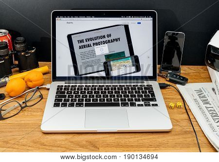 PARIS FRANCE - JUNE 6 2017: Apple Computers website on MacBook Retina in creative environment showcasing latest news from Apple at WWDC 2017 - copy/paste feature of iphone