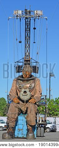 MONTREAL QUEBEC CANADA 19 05 17: The giant deep-sea diver in the street of Montreal for the 375e anniversary of the city, by Royal De Luxe company Nantes France
