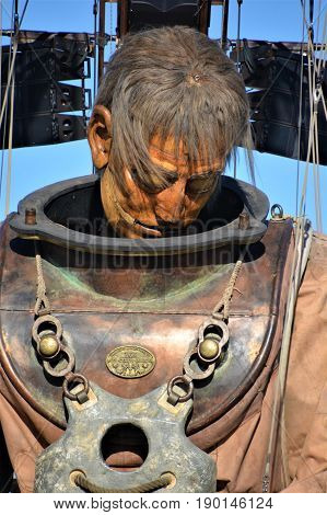 MONTREAL QUEBEC CANADA 19 05 17: The giant deep-sea diver sleeping in the street of Montreal for the 375e anniversary of the city, by Royal De Luxe company Nantes France