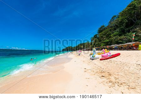 BORACAY, WESTERN VISAYAS, PHILIPPINES - MARCH 25, 2017:  Sports and other activities at Puka Beach Boracay Island Philippines. People have fun at the beach.