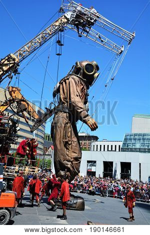 MONTREAL QUEBEC CANADA 19 05 17: The giant deep-sea diver sleeping in the street of Montreal for the 375e anniversary of the city, by Royal De Luxe company Nantes France