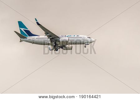 Richmond Canada - June 4, 2017, Jet aircraft in the morning going to YVR Airport