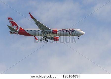 Richmond Canada - June 4, 2017, Jet aircraft in the morning going to YVR Airport