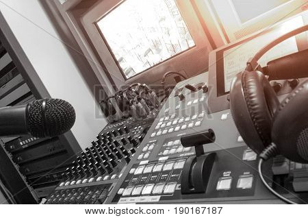Sound recording studio mixing desk with engineer or music producer and class room