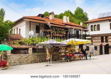 Rozhen, Bulgaria - May 11, 2017: Street view with shop selling traditional bulgarian souvenirs
