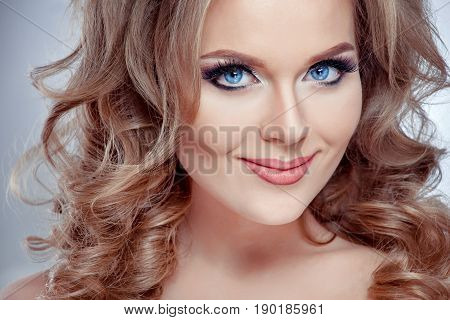 High fashion look close up beauty portrait of beautiful young woman model with bright makeup with perfect clean skin