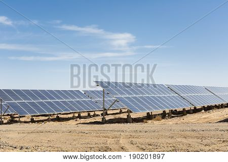solar panels on the gobi against abundant sunshine sky clean energy background
