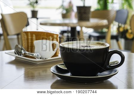 Coffee cup and layercake at coffee shop