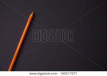 Colour pencils isolated on black background close up