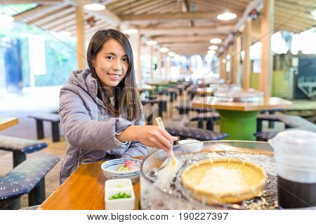 Woman eating somen in Japan