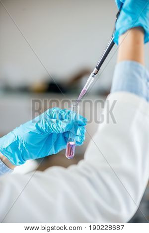 Laboratory Technician With Micro Pipette, Toned Image, Indoors, One Person Only