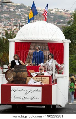 FUNCHAL PORTUGAL - SEPTEMBER 4 2016: Group of people in traditional costume durnig historical and ethnographic parade of Madeira Wine Festival in Funchal. Madeira Portugal