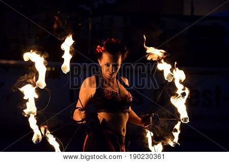 ZAGREB - MAY 2017 : Cest is d'Best famous street festival with many performers on May 2017 in Zagreb. Yanika fire performer doing her dance with fire