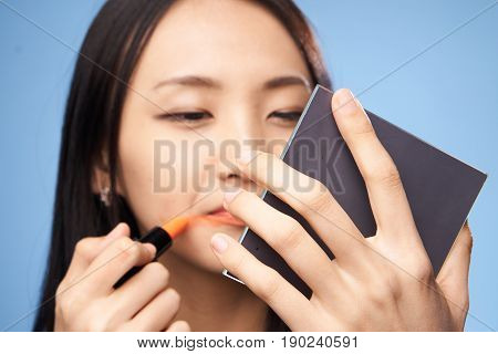 Woman asian make-up, asian colors lips, close-up.