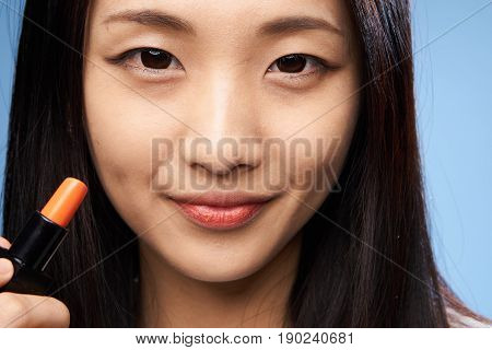 Woman asian make-up, asian colors lips, close-up.