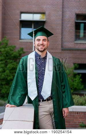College student graduation lifestyle portrait on campus at a university.