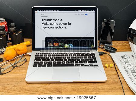PARIS FRANCE - JUNE 6 2017: Apple Computers website on MacBook Retina in creative environment showcasing latest news from Apple at WWDC 2017 - new thunderbolt 3 connection on imac