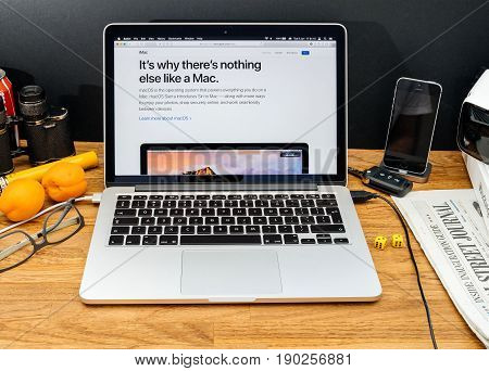 PARIS FRANCE - JUNE 6 2017: Apple Computers website on MacBook Retina in creative environment showcasing latest news from Apple at WWDC 2017 - iMac macOS new feature