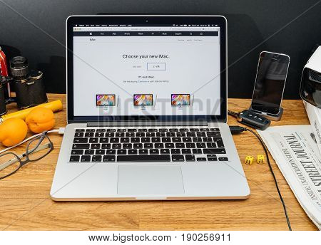PARIS FRANCE - JUNE 6 2017: Apple Computers website on MacBook Retina in creative environment showcasing latest news from Apple at WWDC 2017 -