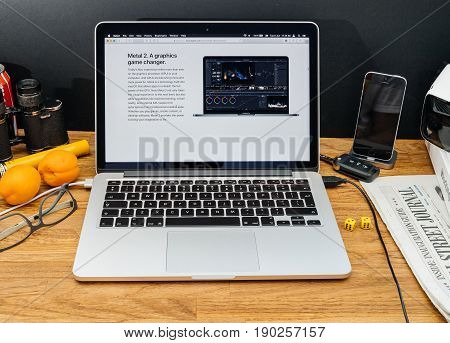 PARIS FRANCE - JUNE 6 2017: Apple Computers website on MacBook Retina in creative environment showcasing latest macOS High Sierra from Apple at WWDC 2017 - Metal 2 GPU accelaration in OS