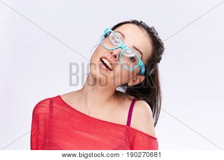 Young woman in transparent blue glasses, portrait on white background.