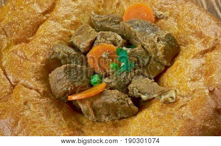 Arab flapjackwith beef sauce. Maghreb cuisine. close up.