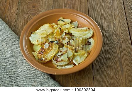 Lyonnaise potatoes - French dish fried potatoes with onion parsley and garlic.