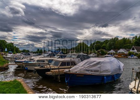 Boats Anchored On The Bank Of The River, Residential Houses On The Other Side, Beautiful Broad River