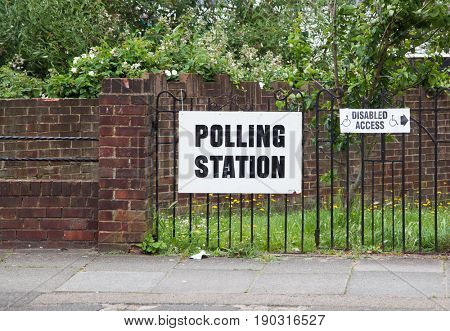 LONDON, UNITED KINGDOM - JUNE 8, 2017: A polling station sign is hanged outside during the British general elections in South London, United Kingdom on June 8, 2017.