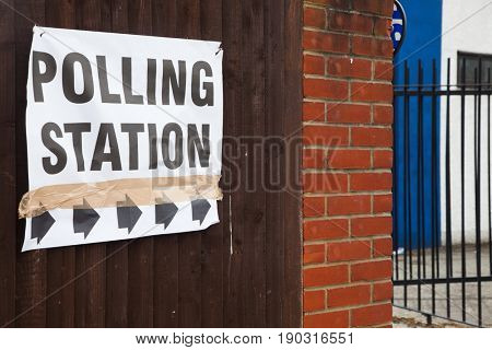 LONDON, UNITED KINGDOM - JUNE 8, 2017: A polling station sign is hanged outside during the British general elections in South London, United Kingdom on June 8, 2017.