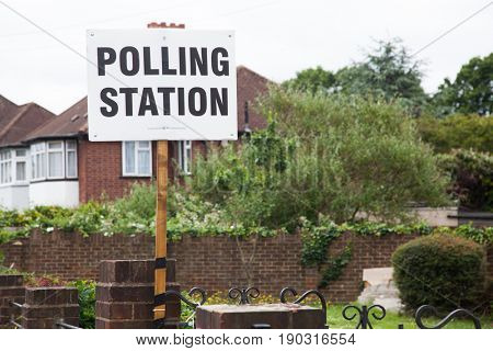 LONDON, UNITED KINGDOM - JUNE 8, 2017: A polling station sign is hanged outside during the British general elections in South London, United Kingdom on June 8, 2017.