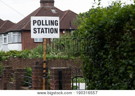 LONDON, UNITED KINGDOM - JUNE 8, 2017: A polling station sign is hanged outside during the British general elections in South London, United Kingdom on June 8, 2017.